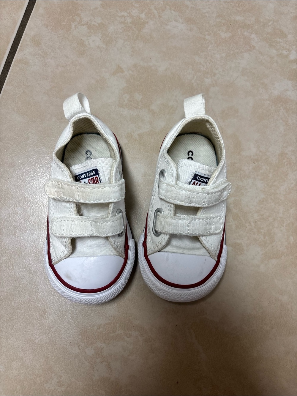 White baby Converse sneakers with red and navy blue stripes size 4